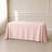 Blush polyester tablecloth 90"x132" with seamless finish on a table.