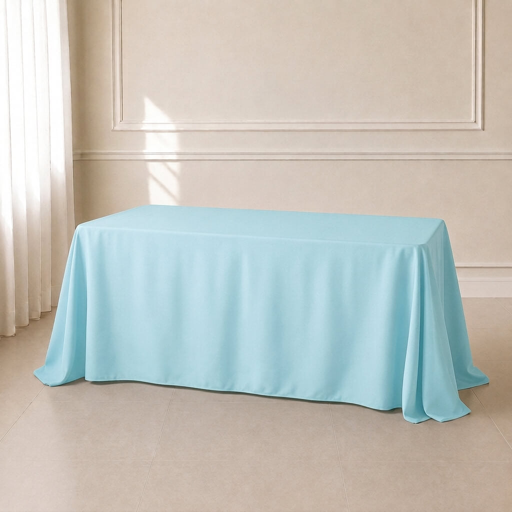 Light blue polyester rectangle tablecloth 90"x132" with seamless finish.
