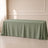 Dusty sage green rectangular tablecloth on a light tiled surface.