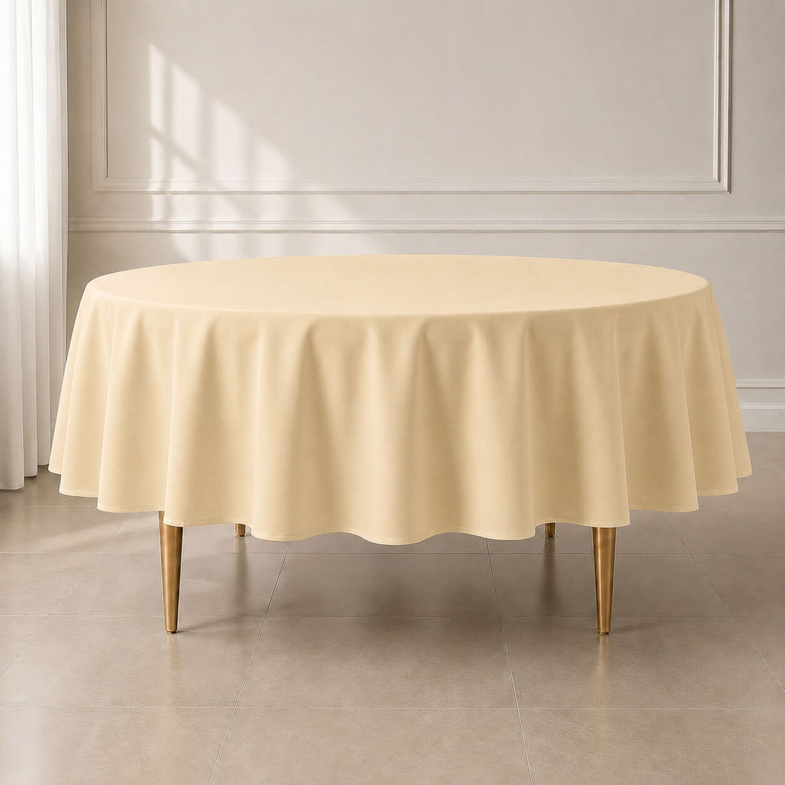 Beige round polyester tablecloth on a dining table.