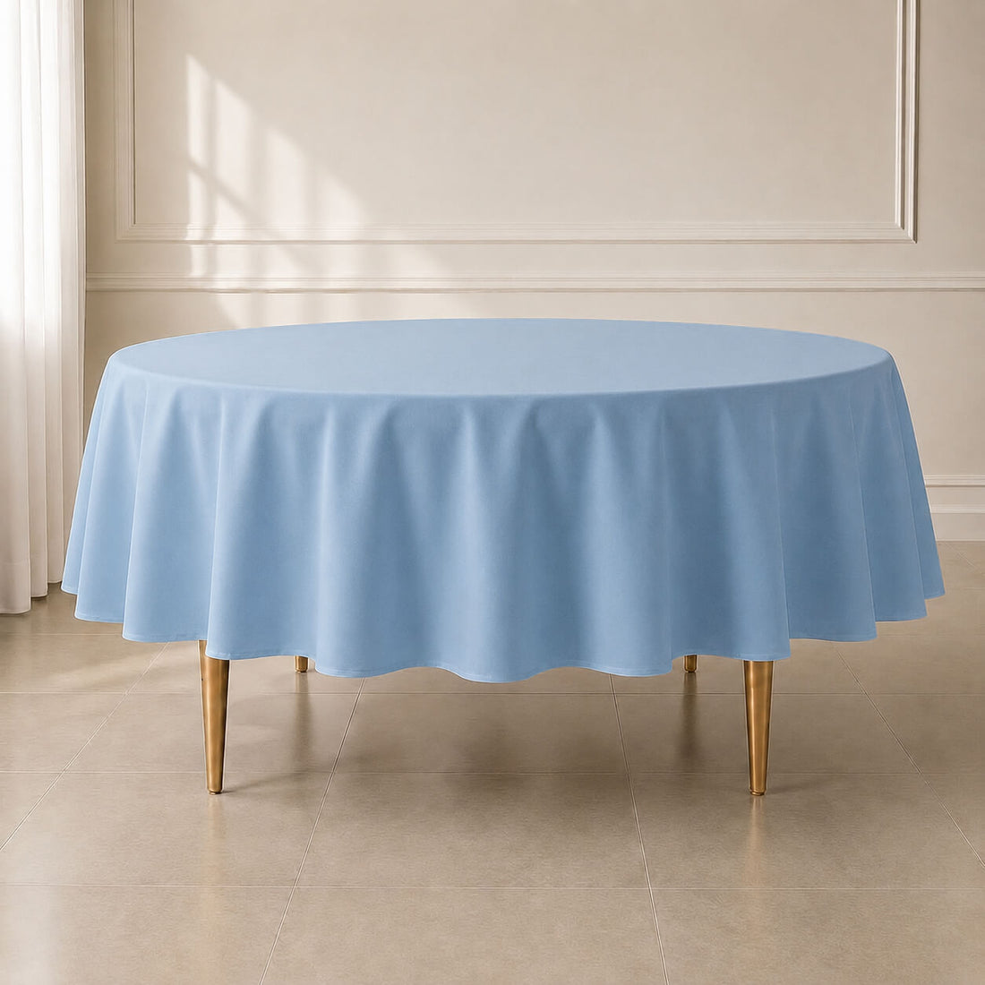 Dusty blue polyester round tablecloth on a round table.