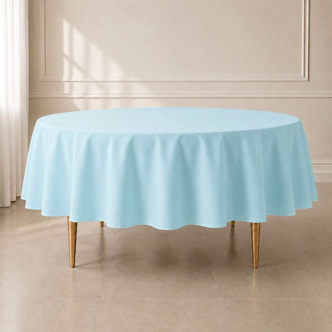 Light blue reusable polyester round tablecloth for elegant dining.
