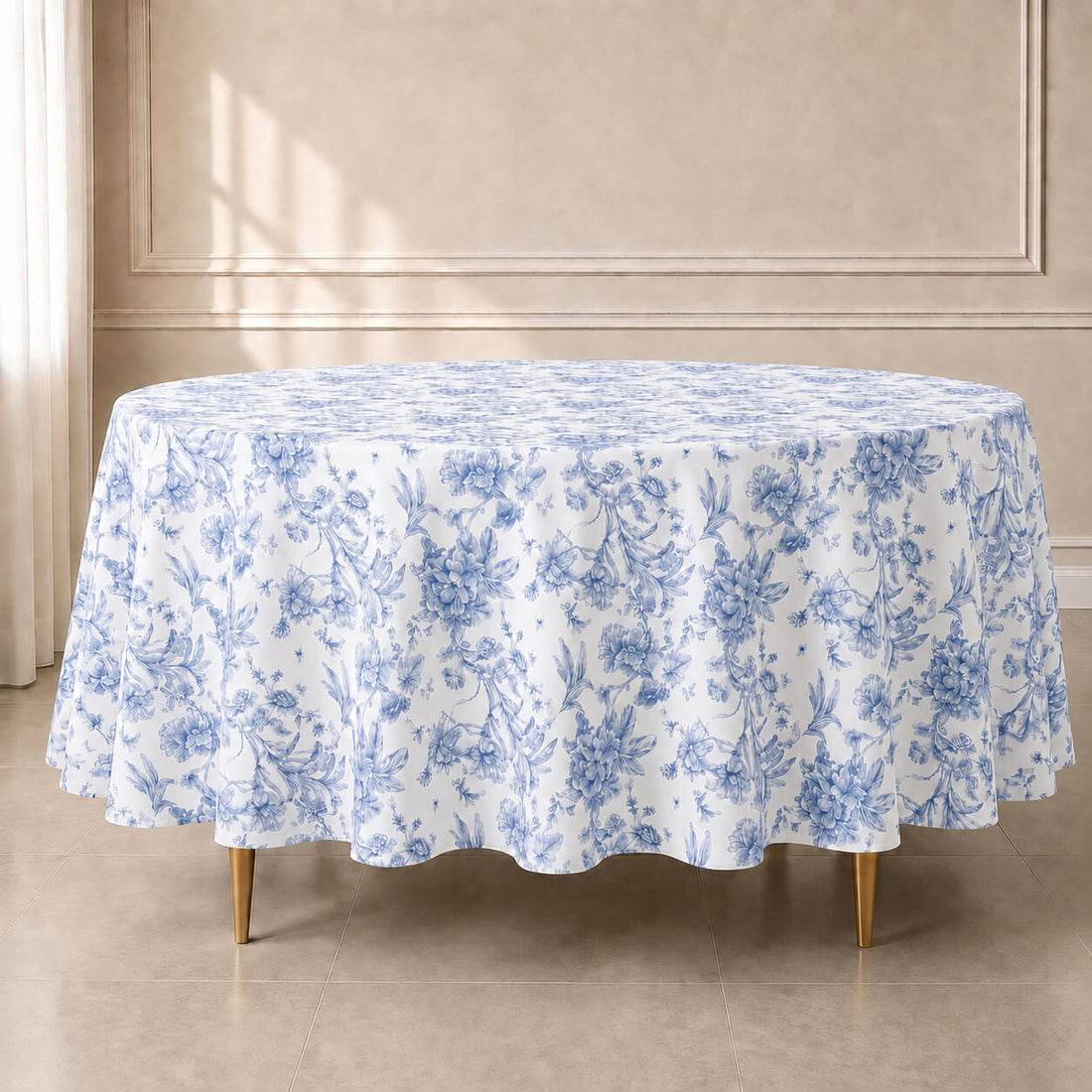 White round tablecloth with blue French toile pattern for weddings and events.