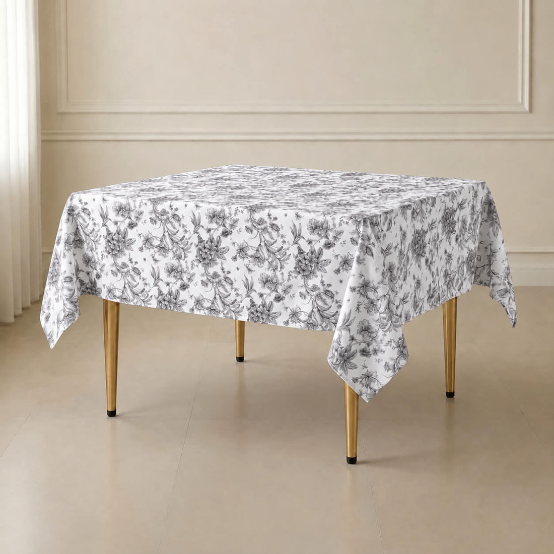 White table overlay with black French toile pattern for elegant events.