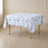 White table overlay with blue French toile pattern for weddings and events.