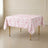 White tablecloth with pink French toile pattern for elegant events.