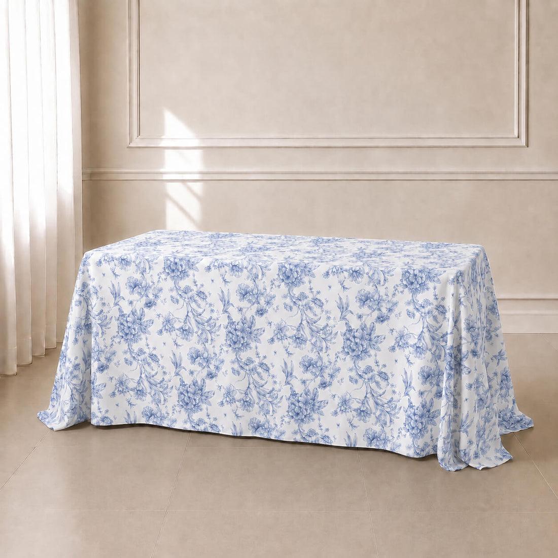 White tablecloth with blue French toile pattern for elegant events.