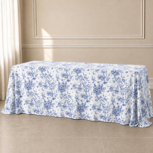 White tablecloth with blue French toile pattern for elegant events.