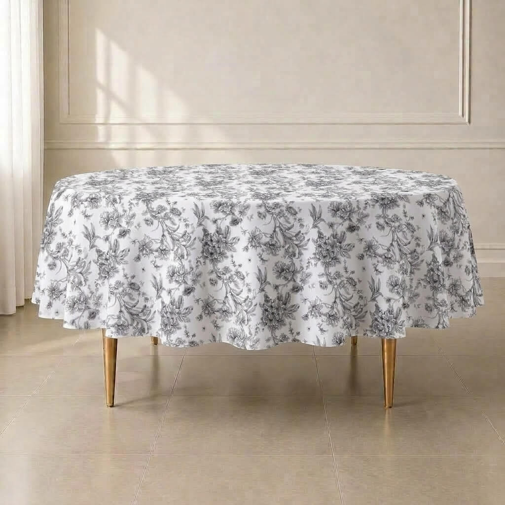 White round tablecloth with black French toile pattern for sophisticated events.