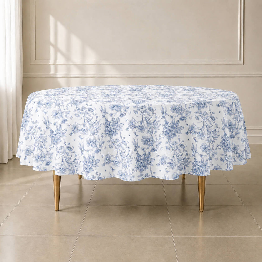 White tablecloth with blue French toile pattern for elegant events.