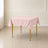 Blush wrinkle-resistant polyester square tablecloth 54"x54" on a table.