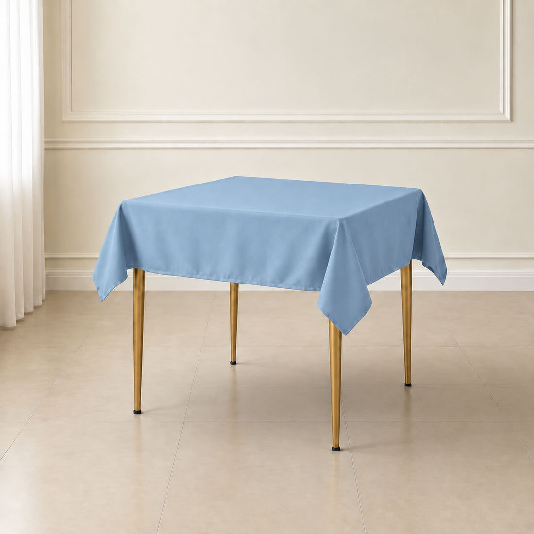 Dusty blue wrinkle-resistant square tablecloth on a table.