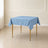 Dusty blue wrinkle-resistant square tablecloth on a table.