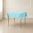 Light blue wrinkle-resistant table overlay on a square table.