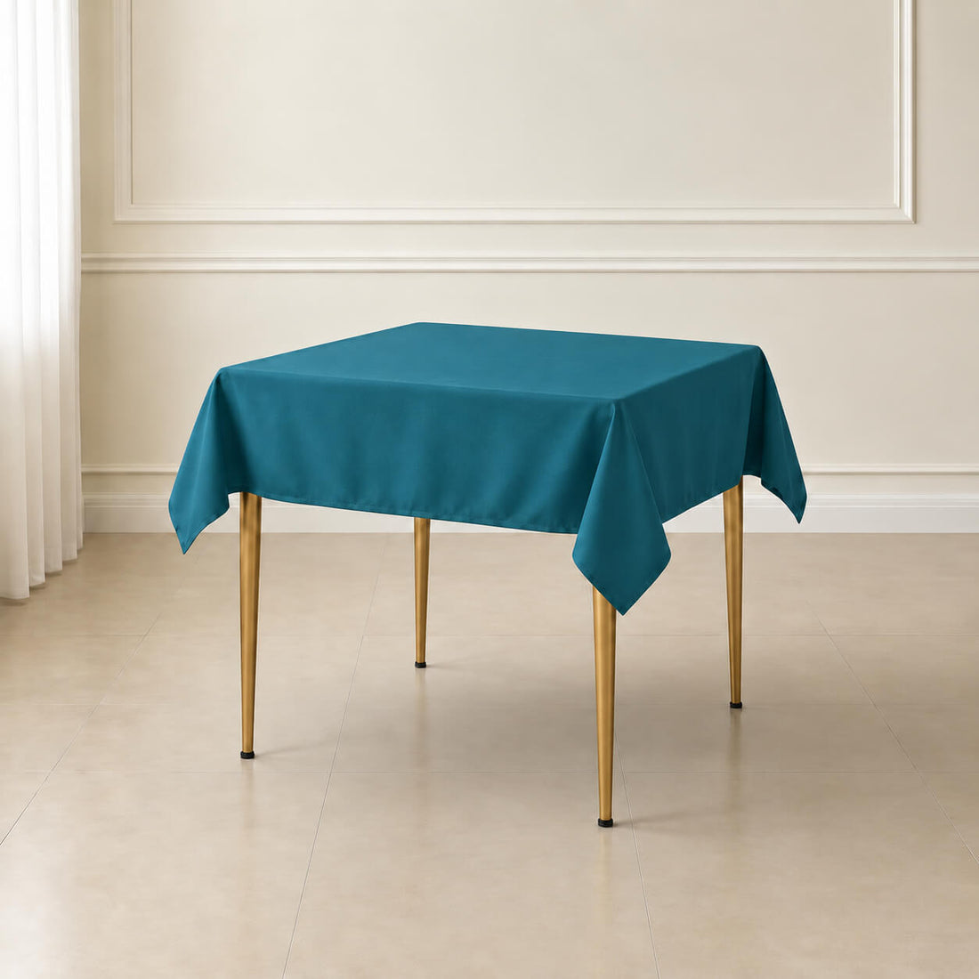 Peacock teal wrinkle-resistant square tablecloth on a wooden table.