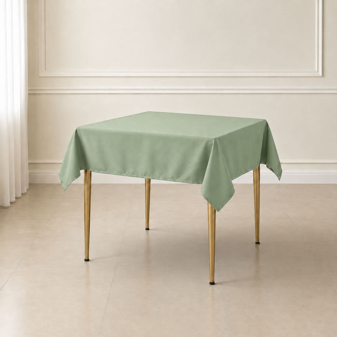 Sage green wrinkle-resistant square tablecloth on a dining table.