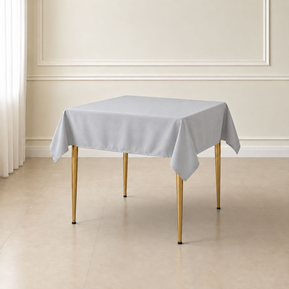 Silver wrinkle-resistant square tablecloth on a dining table.