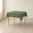 Olive green wrinkle-resistant table overlay 54"x54" on a square table.