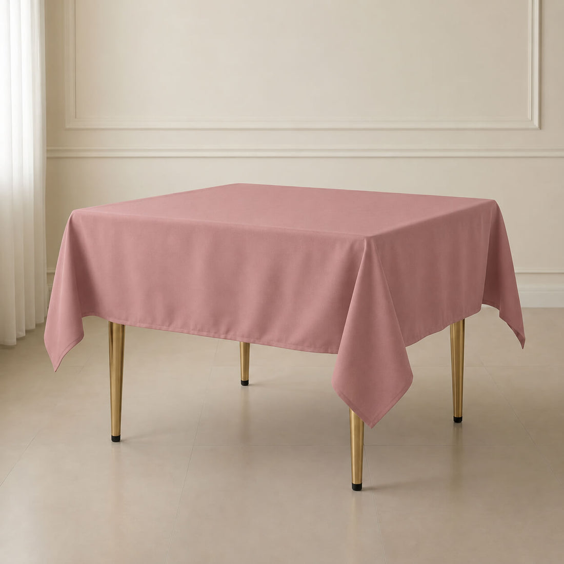 Dusty rose wrinkle-resistant square tablecloth on a dining table.