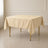 Beige wrinkle-resistant polyester square tablecloth on a table.