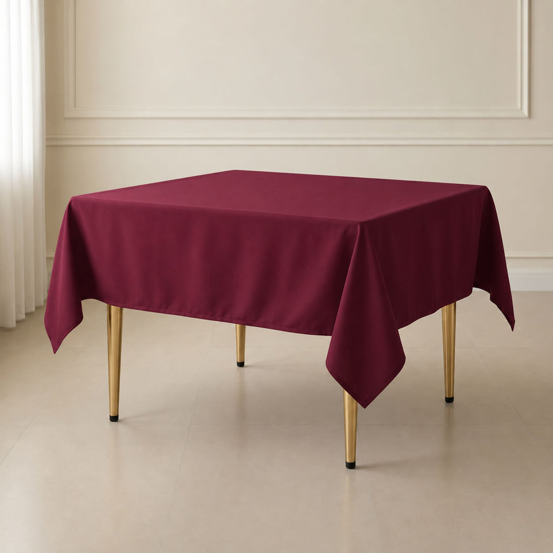 Burgundy wrinkle-resistant square tablecloth on a table.