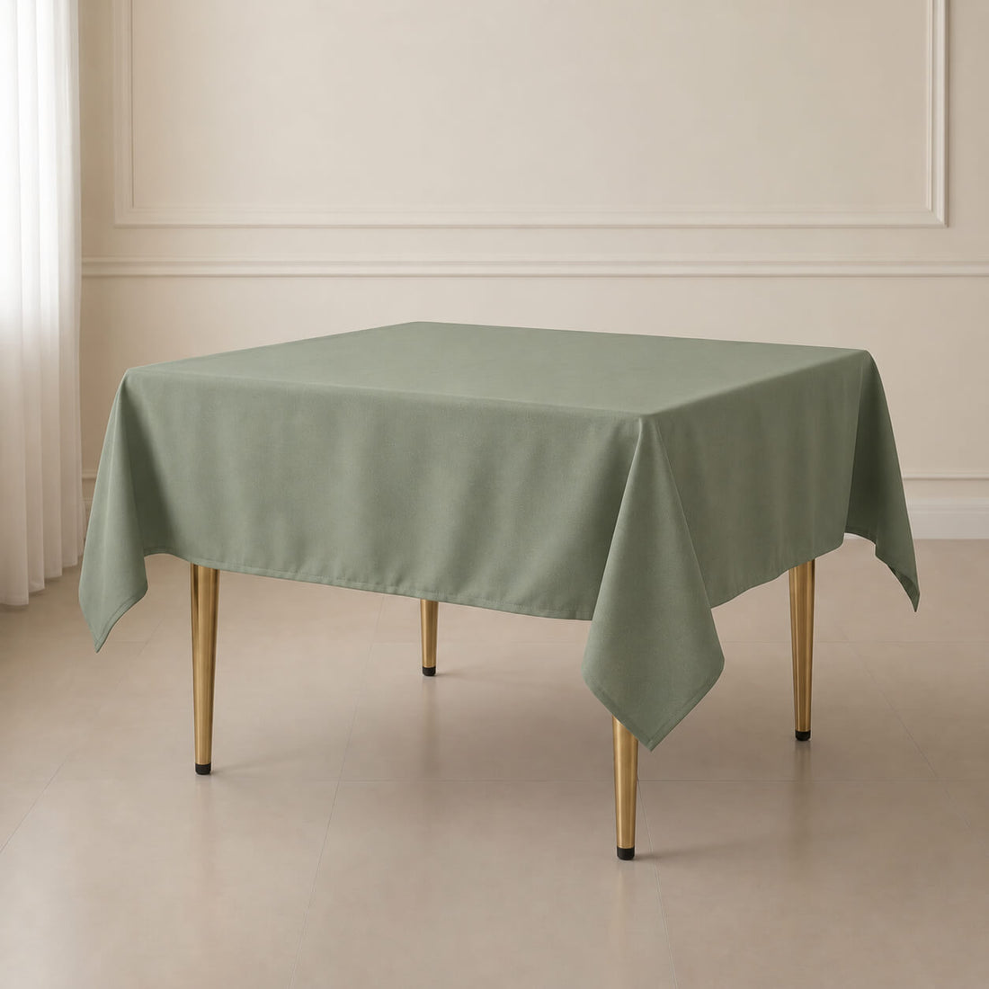 Dusty sage green wrinkle-resistant table overlay on a square table.
