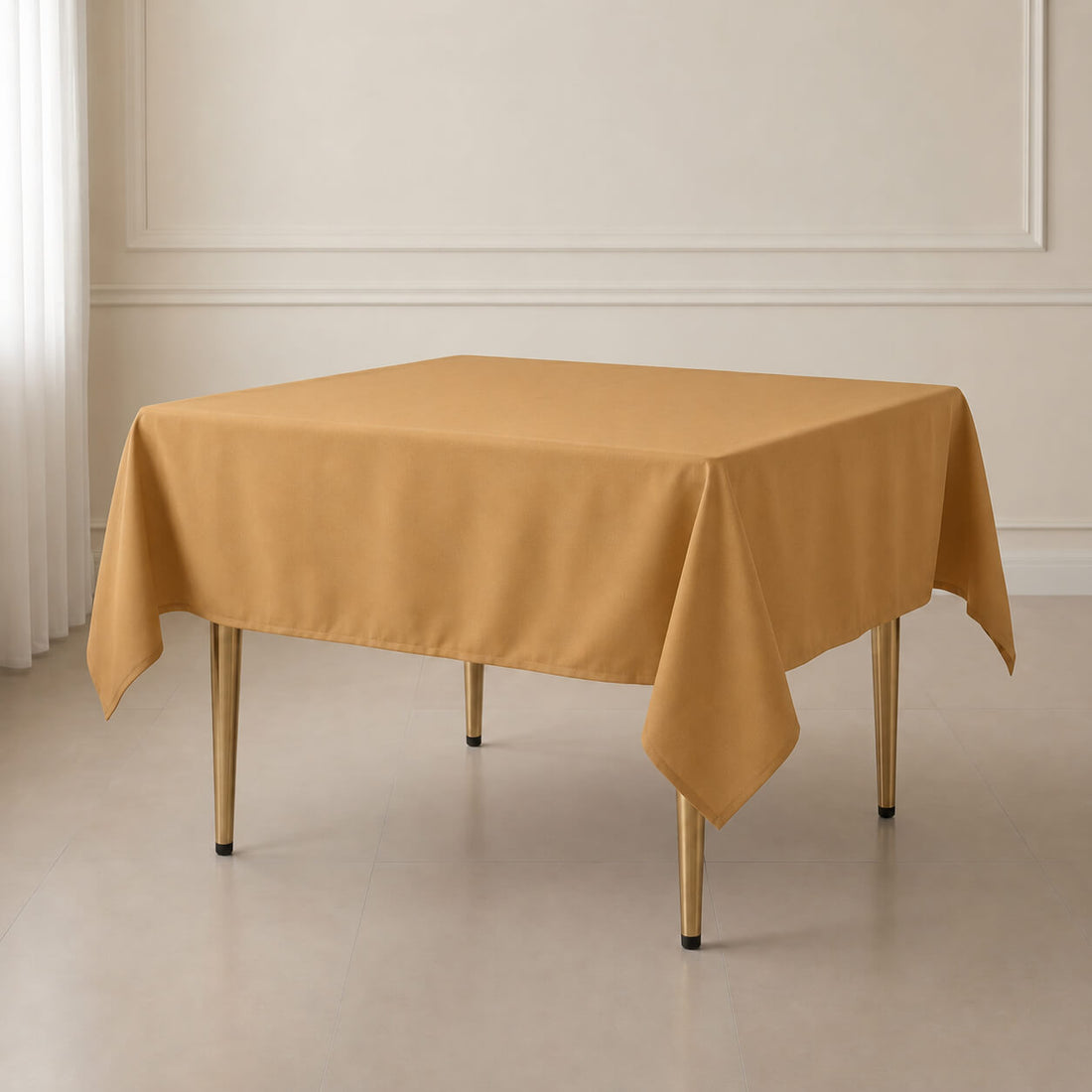 Gold wrinkle-resistant square tablecloth for stylish events.