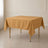 Gold wrinkle-resistant square tablecloth for stylish events.