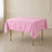 Pink wrinkle-resistant square tablecloth 70"x70" on a table.