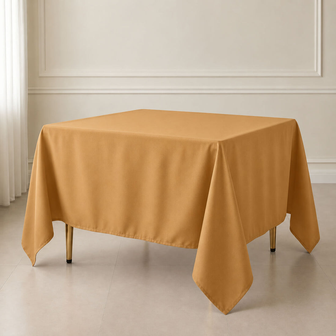 Gold polyester tablecloth 90"x90" for weddings and special occasions.