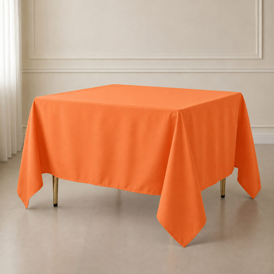 Orange wrinkle-resistant polyester square tablecloth on a dining table.