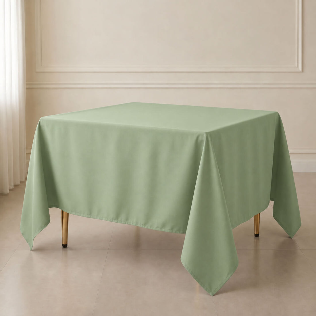Sage green wrinkle-resistant polyester square tablecloth on a dining table.