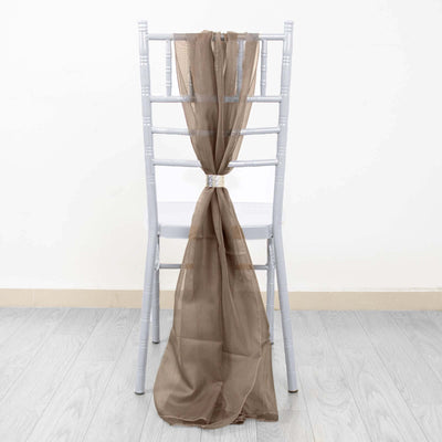 Brown sheer chair sash tied around a gray chiavari chair.