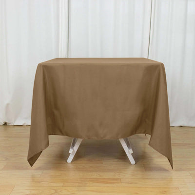 Brown tablecloth draped over a table in a studio setting.