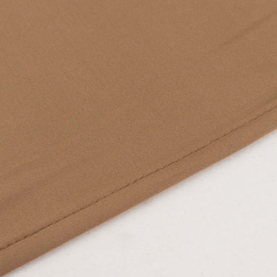 Close-up of soft brown fabric texture with stitching detail.