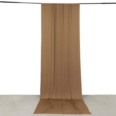 Brown fabric drape hanging in studio setting