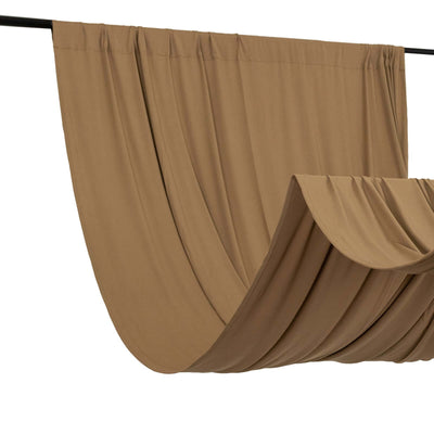 Brown fabric drape on a black rod, showcasing soft texture and flow.