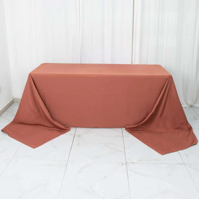 Rust-colored tablecloth draped elegantly over a table.