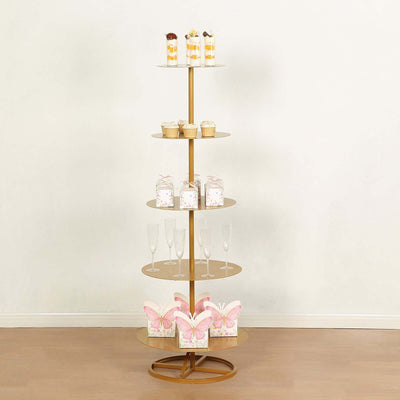 Gold dessert stand with cupcakes and treats in a staged setting.