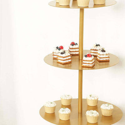 Gold tiered dessert stand with assorted cupcakes and pastries.