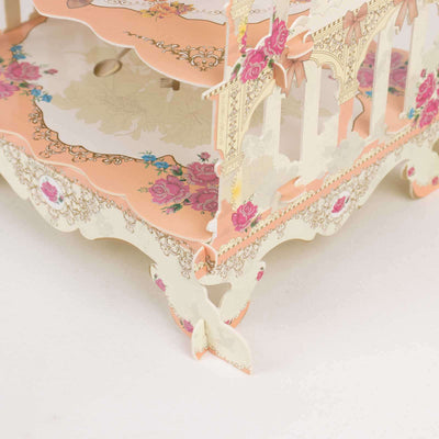 Decorative paper display stand with floral design and intricate details.
