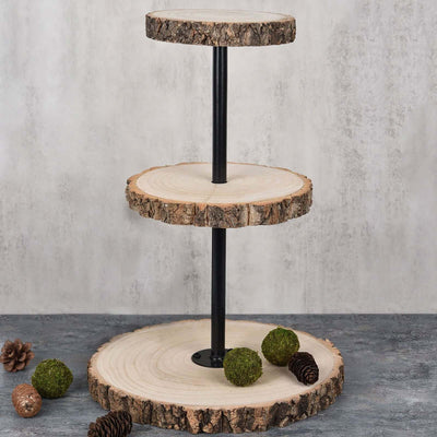 Three-tier rustic wood display stand with natural bark edges and decorative moss balls.