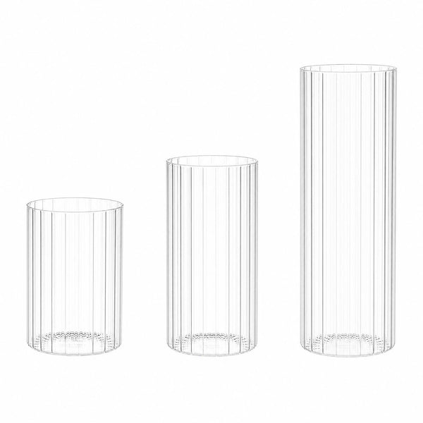 Three clear ribbed glass tumblers in three sizes on a white background#whtbkgd