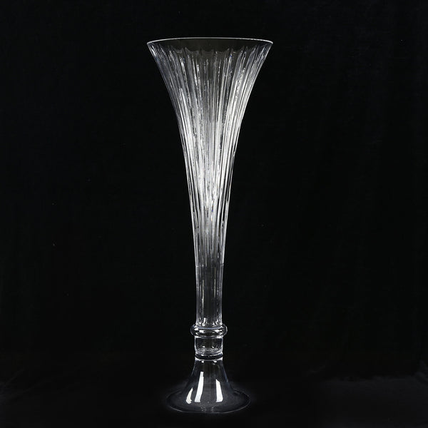 Elegant clear fluted crystal vase on black background