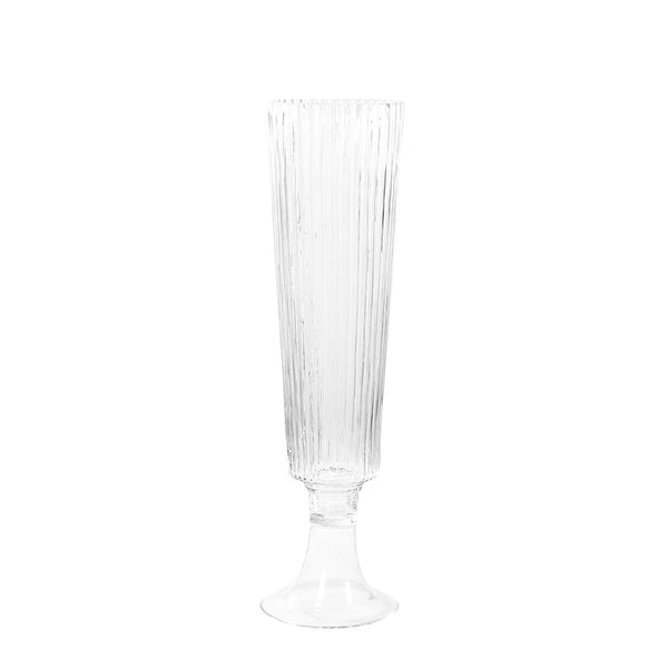 Clear ribbed champagne flute on a plain background. #whtbkgd