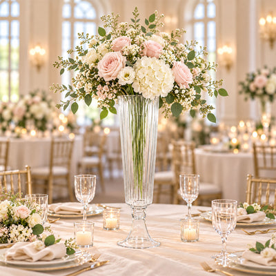 Elegant wedding centerpiece with blush roses, white hydrangeas, and candles