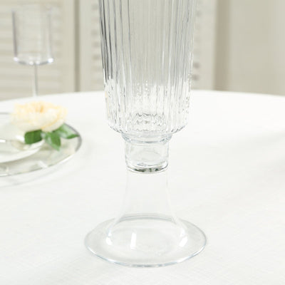 Elegant ribbed crystal champagne flute on white table setting