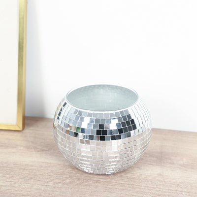 Silver mosaic glass votive candle holder on wooden surface