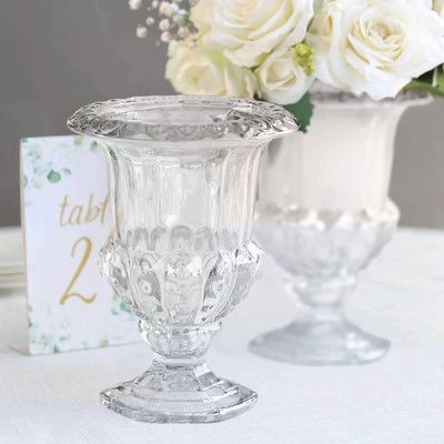 Elegant clear glass vase with ornate design, perfect for floral arrangements.