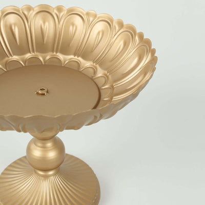Gold decorative pedestal dish with intricate design.